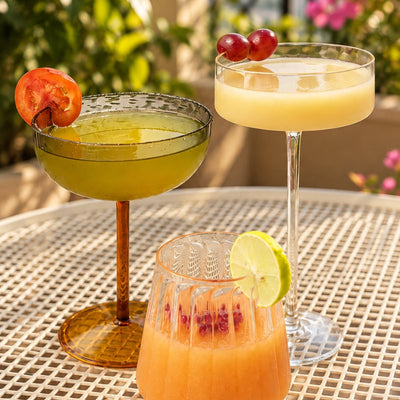 Glassware: cocktails in a coupe and a stemmed glass