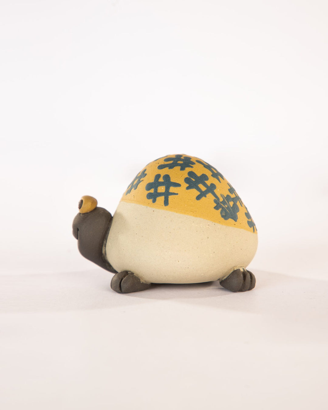 Kachhua Turtle Nerikomi Ceramic Figurine - Ochre Octothorpe - view 3 of 4